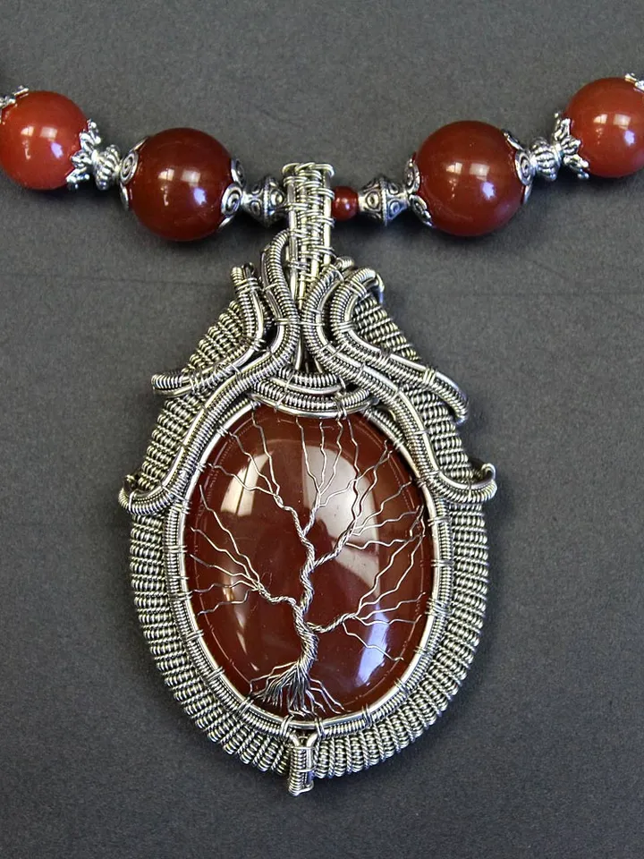 The Tree of Life necklace is handmade with natural birthstones.