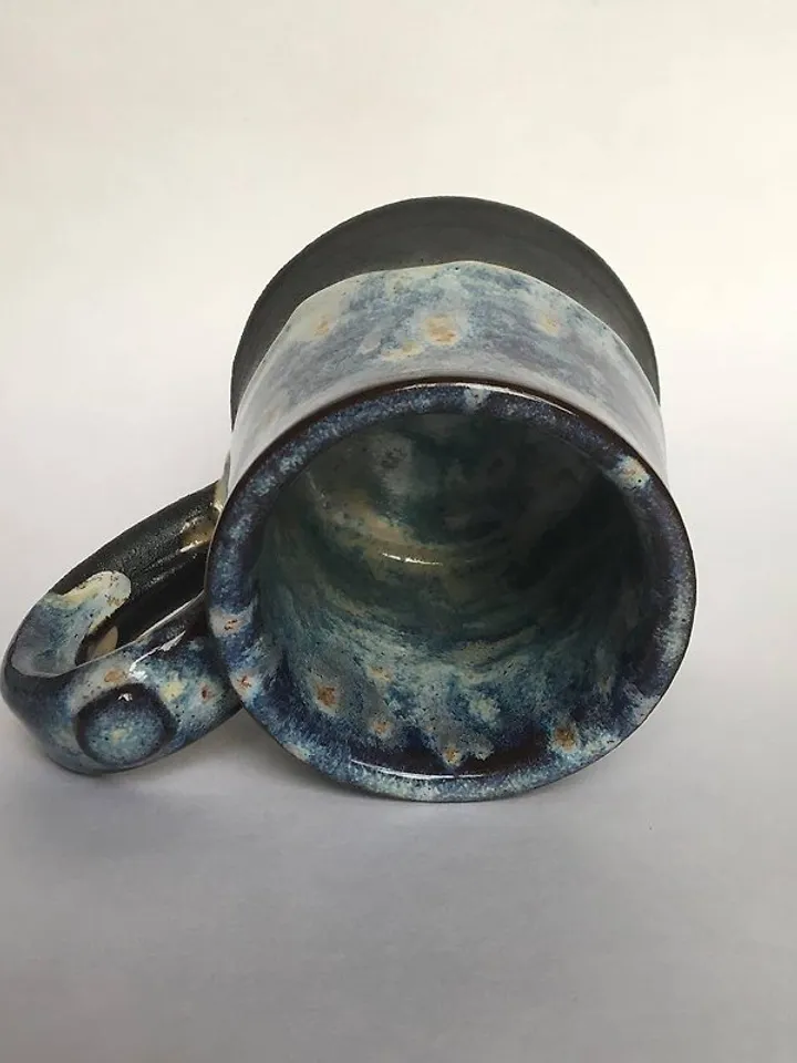 Trinity knot Triquetra in circle blue and black galaxy glazed stoneware mug