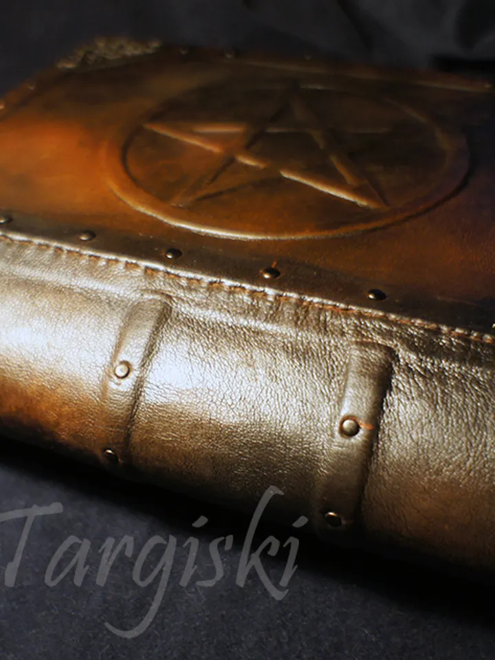 Big brown leather grimoire with a pentagram