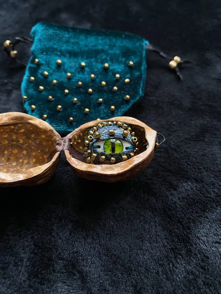 Green dragon eye brooch in walnut shell, green eye badge