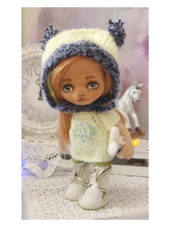 Cute little girl doll with a bunny