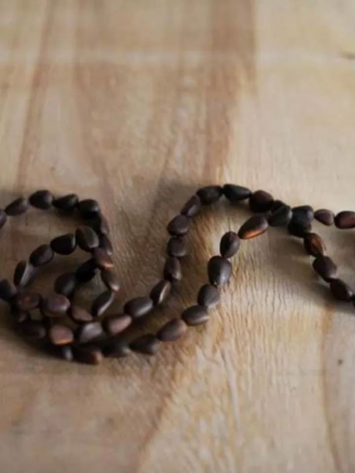 Accessory beads made from Siberian cedar seeds