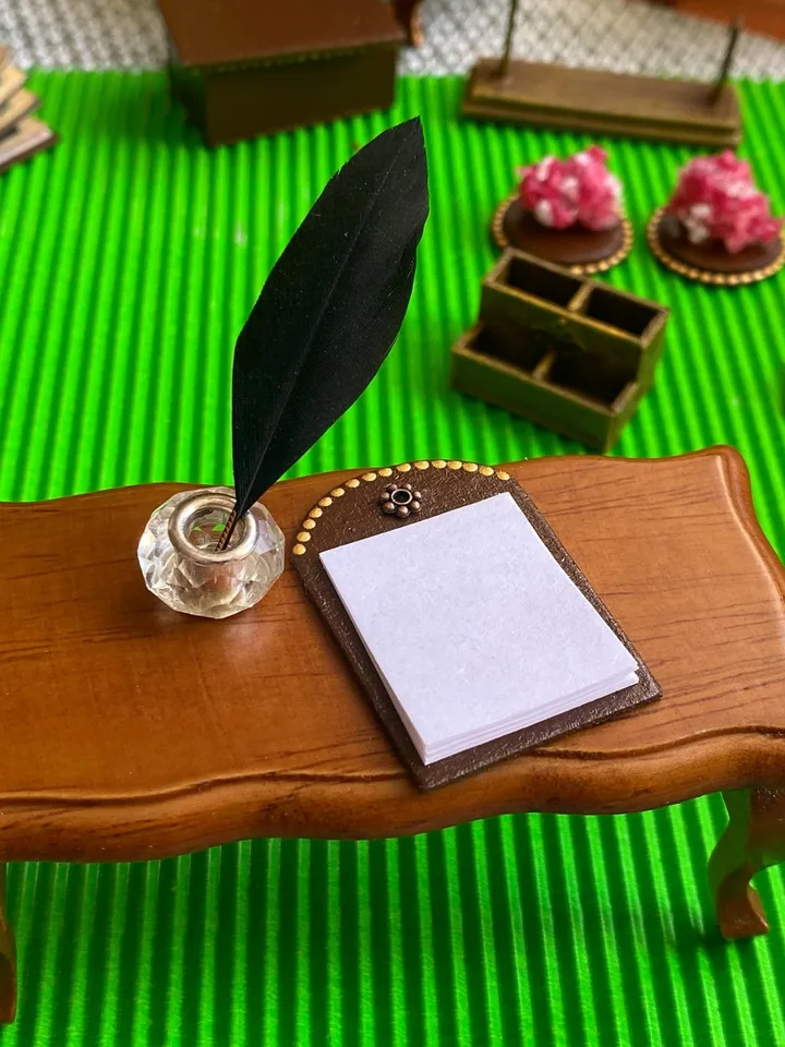Dollhouse set. Inkwell with feather.