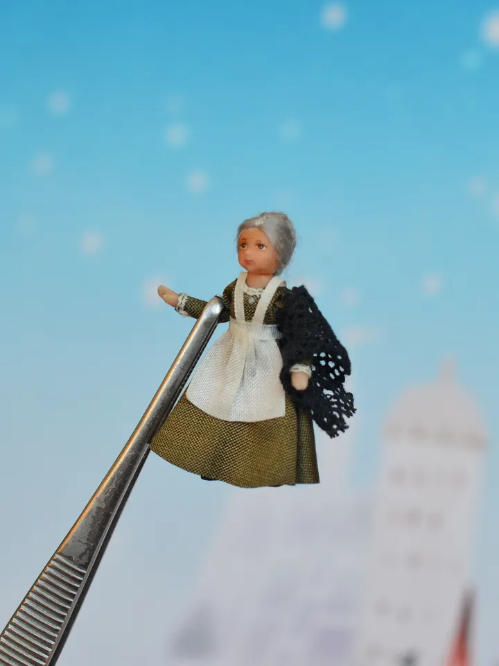 Miniature doll in the 48th scale. Grandmother for a dollhouse.
