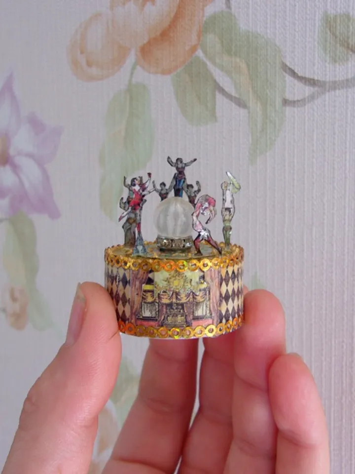 Mini circus with lights. acrobats on stage. LED candle