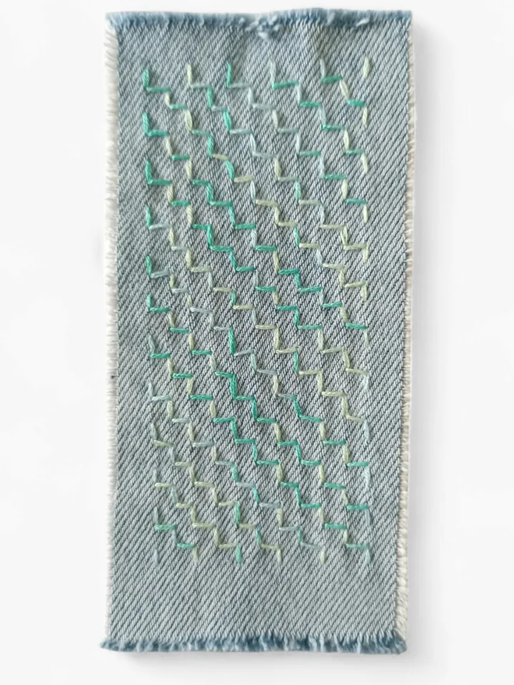 Sashiko patch hand sewn from recycled denim.