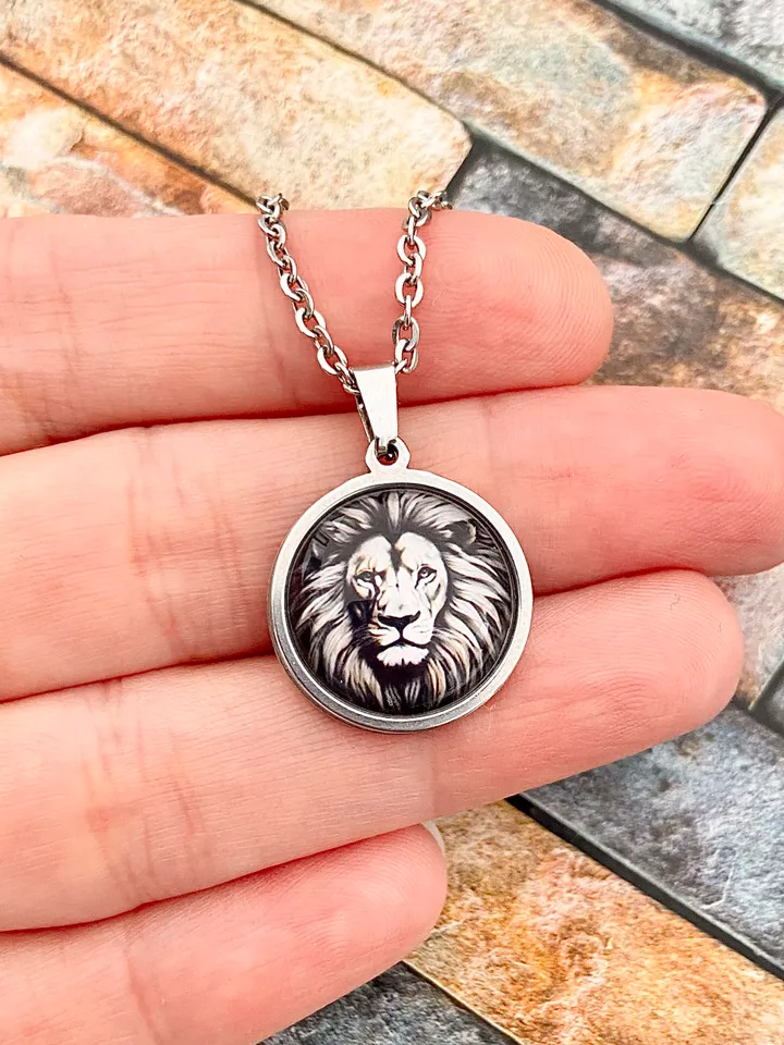Lion, steel pendant with glass