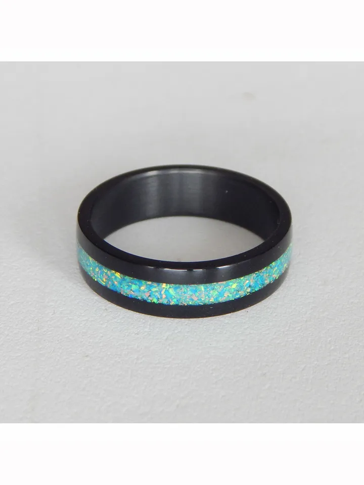 Stylish black ring. Carbon ring with synthetic opal. 9 1/4