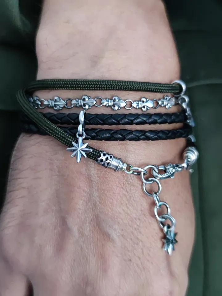 Designer multilayer bracelet with elements of chain, genuine leather and paracord