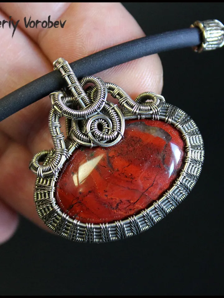Handmade necklace with a pendant made of jasper and nickel silver wire.