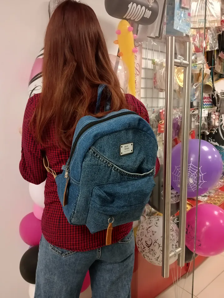 Everyday denim backpack made from recycled jeans, 3 pockets outside (1 volumetric with a zipper), 2 pockets inside (1 with a zipper) 100 percent cotton inside, strong handles made of cotton straps, leather strips on the zipper puller. decorated with a lab