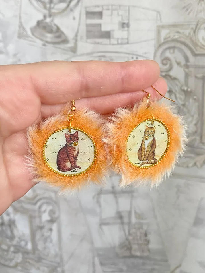 Cute handmade earrings. Image of cats, fur trim.