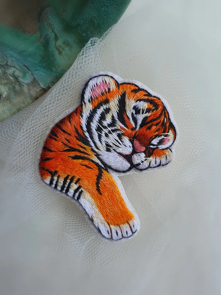 Sleeping Tiger Cub Brooch. Hand-embroidered with satin stitch