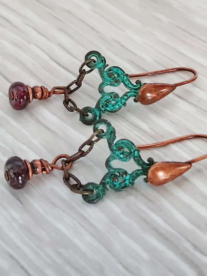 Boho Shabby chic Vintage style solid and natural copper earrings Textured patinated with a garnet bead and chain