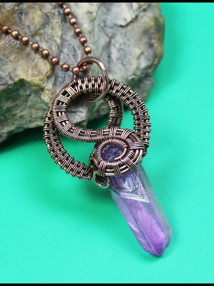 Handmade copper wire pendant with quartz crystal.