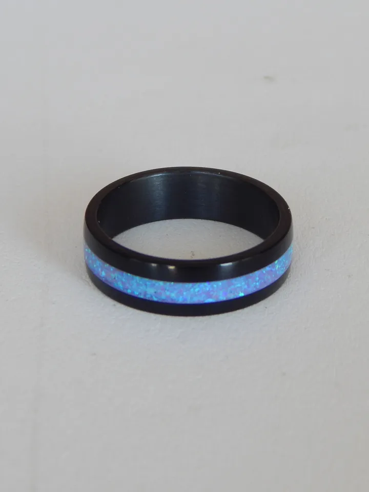 Stylish black ring. Carbon ring with synthetic opal. 7