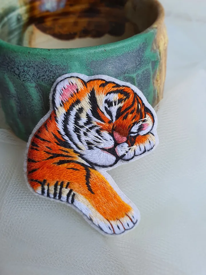 Sleeping Tiger Cub Brooch. Hand-embroidered with satin stitch