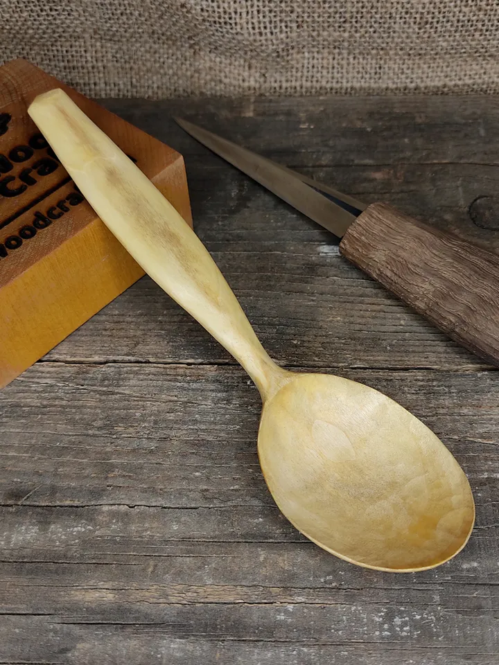Handmade wooden spoon from natural maple wood with comfortable handle for eating