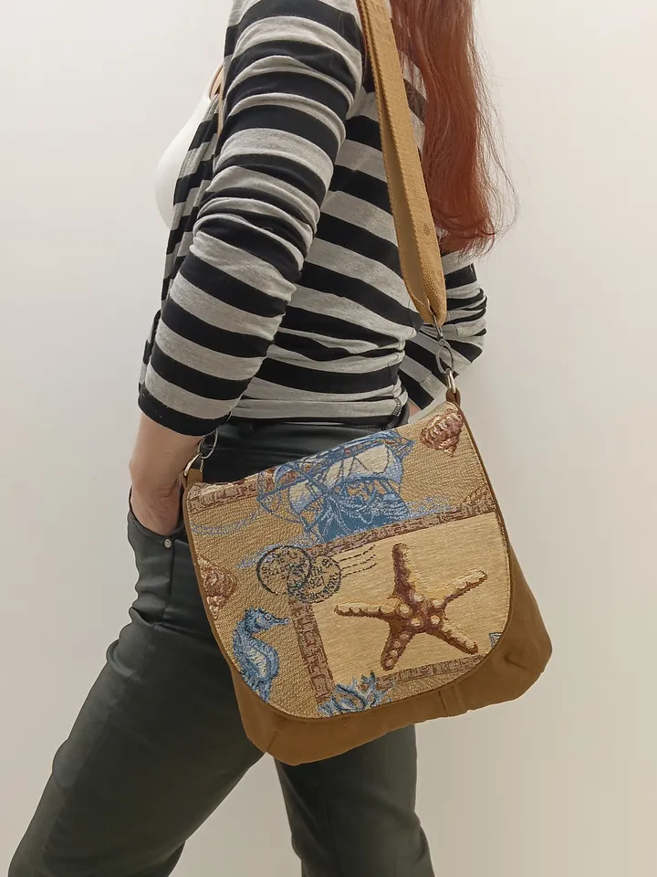 Brown crossbody /shoulder denim bag, a women's messenger bag with a tapestry flap with a marine theme pattern and denim shoulder bag with 4 pockets inside and an adjustable strap.