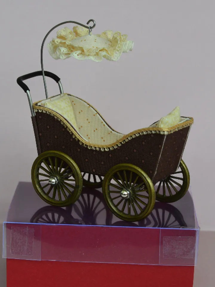 Miniature toy stroller for two small dolls. Handmade miniature stroller for small dolls.