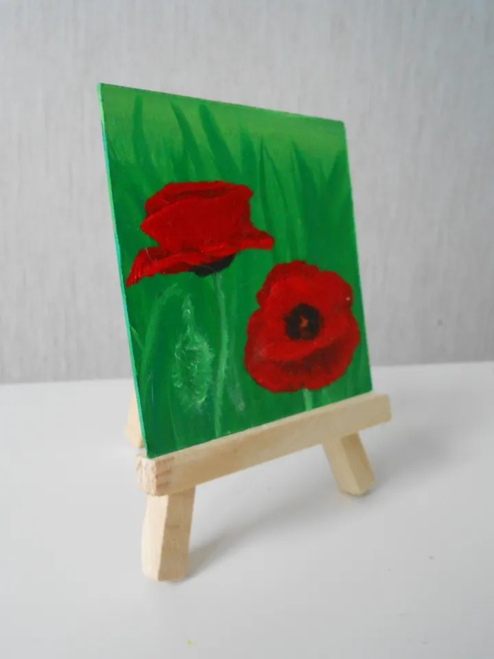 Poppies.Red flowers.A bright miniature of a poppy with oil paints.