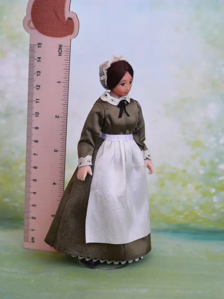 Miniature nanny doll for Victorian dollhouse in 1/12th scale.