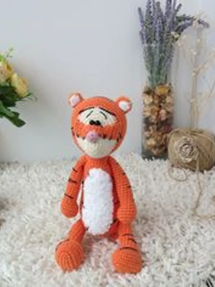 Orange tiger cub Disney cartoon character. Stuffed animal tiger soft toy