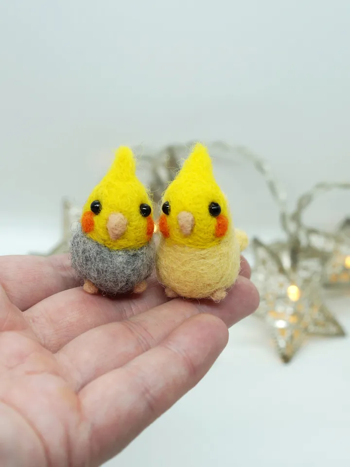 A pair of needle felted miniature cockatiels, made to order.