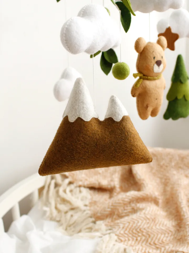 Felt woodland bear with clouds, spruce tree and mountain baby crib mobile hand sewing PDF tutorial with patterns. DIY forest nursery baby cot decoration