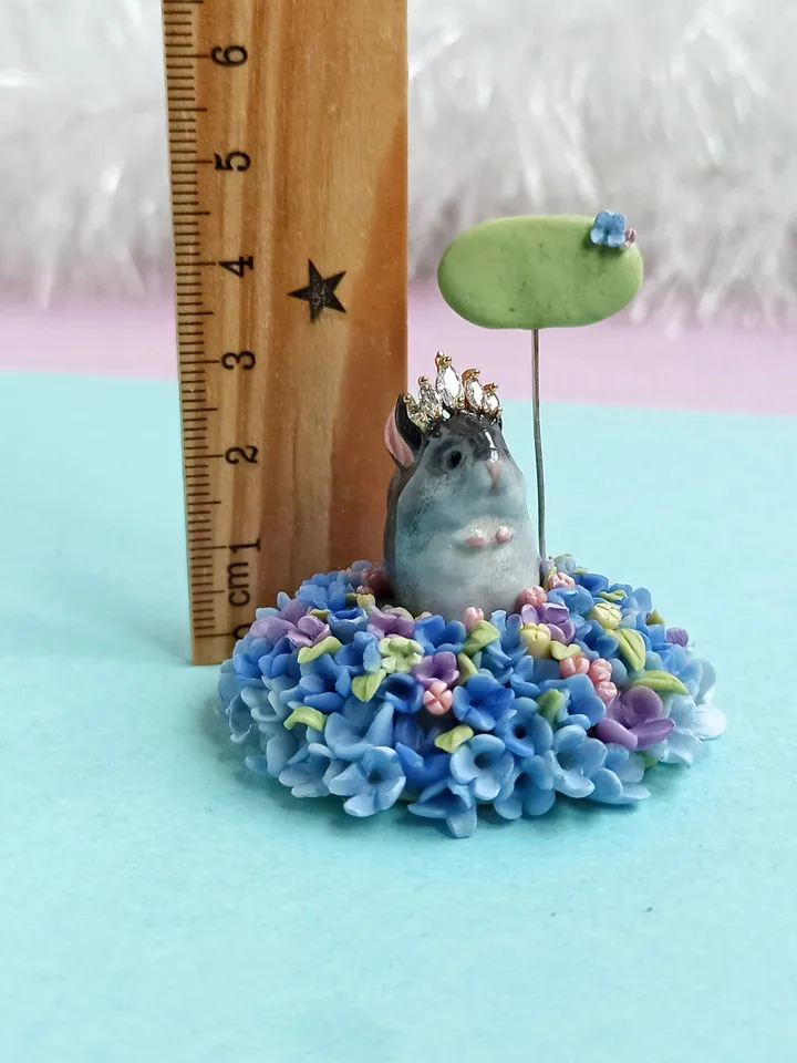 a tiny chinchilla figurine on the blue flower base with nameplate (US discount)