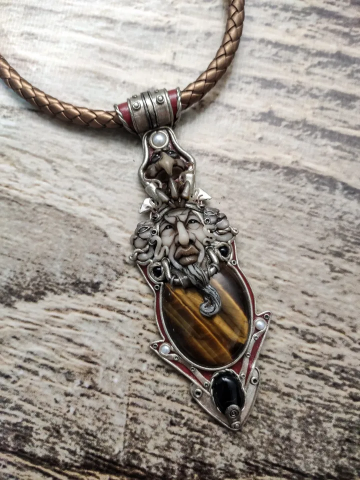 Necklace Shaman on a leather cord. Central cabochon natural tiger eye stone.