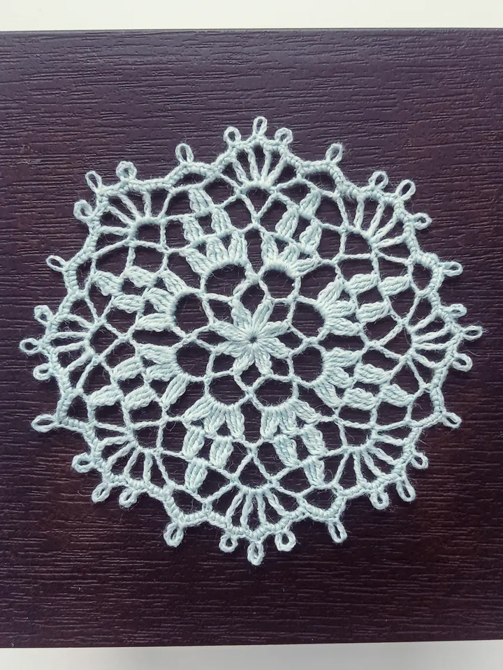 Miniature blue doily