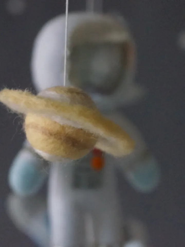 A space mobile for astronaut's nursery, a Shuttle and a rocket made of felt for the decor boy's room