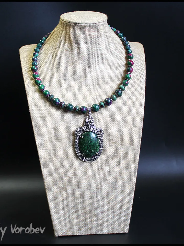 Handmade necklace with a pendant made of natural Zoisite and nickel silver wire.