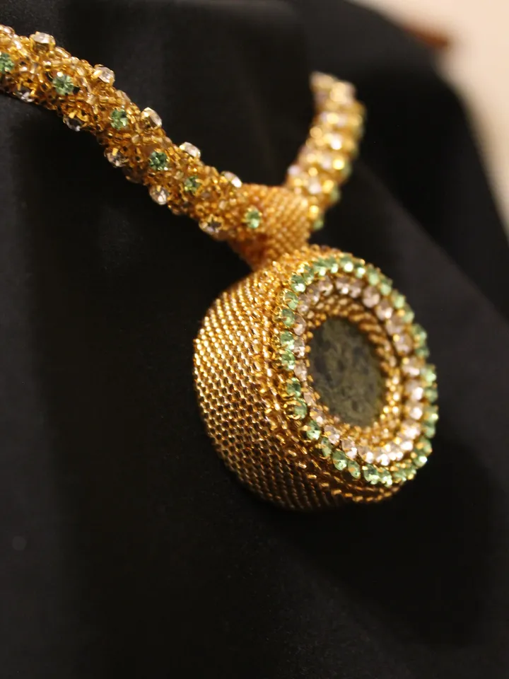 Pendant Japanese beads with a coil and rhinestones