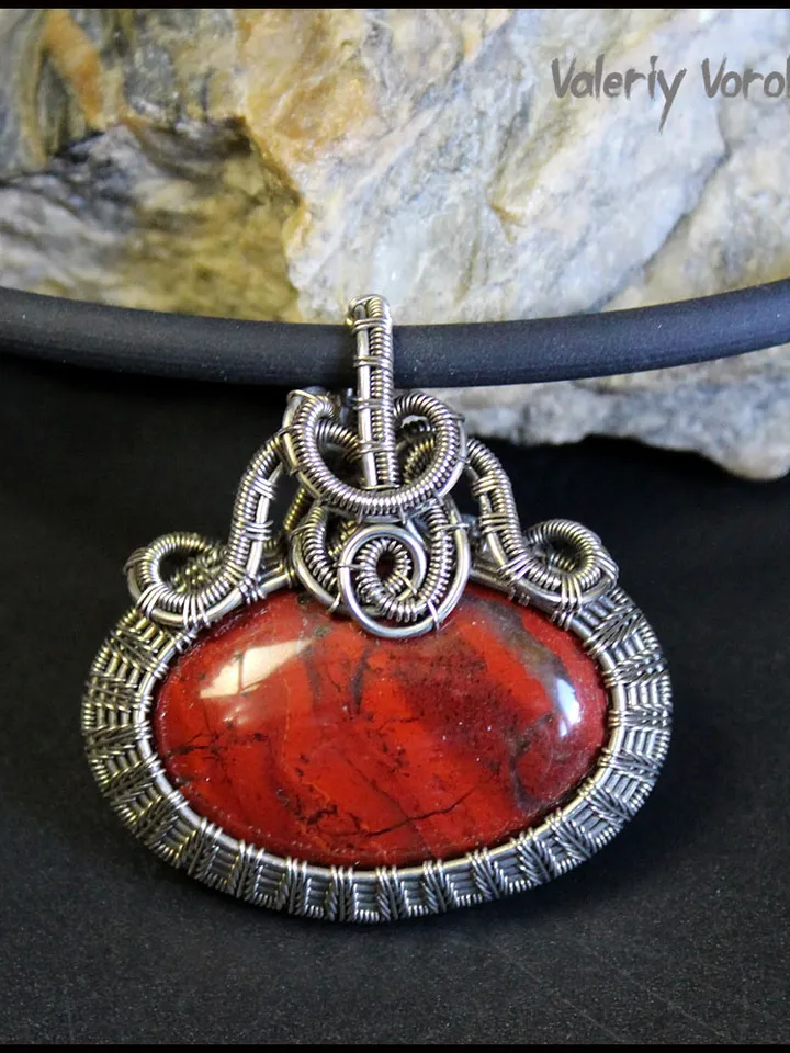 Handmade necklace with a pendant made of jasper and nickel silver wire.