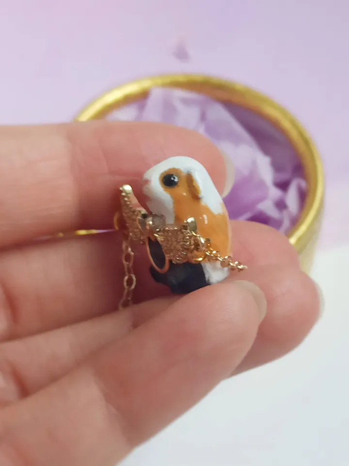 Handmade guinea pig pendant, adorned with rhinestones and gold wings (US discount)