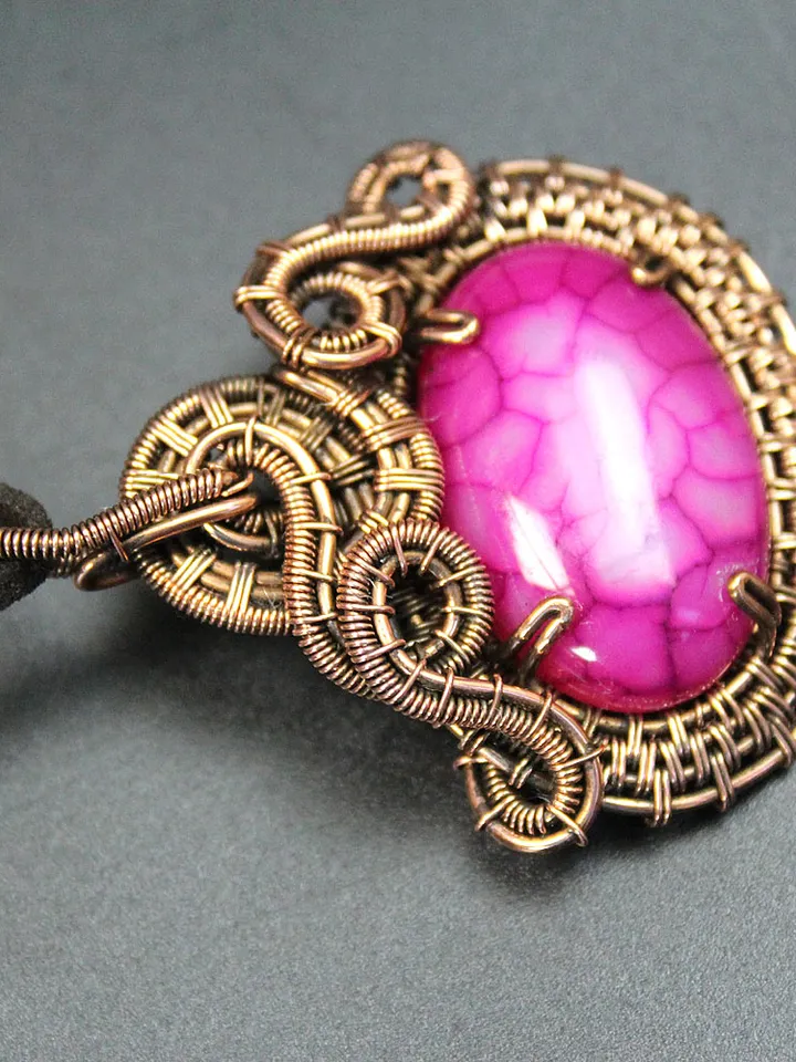 Handmade copper wire and stone pendant.