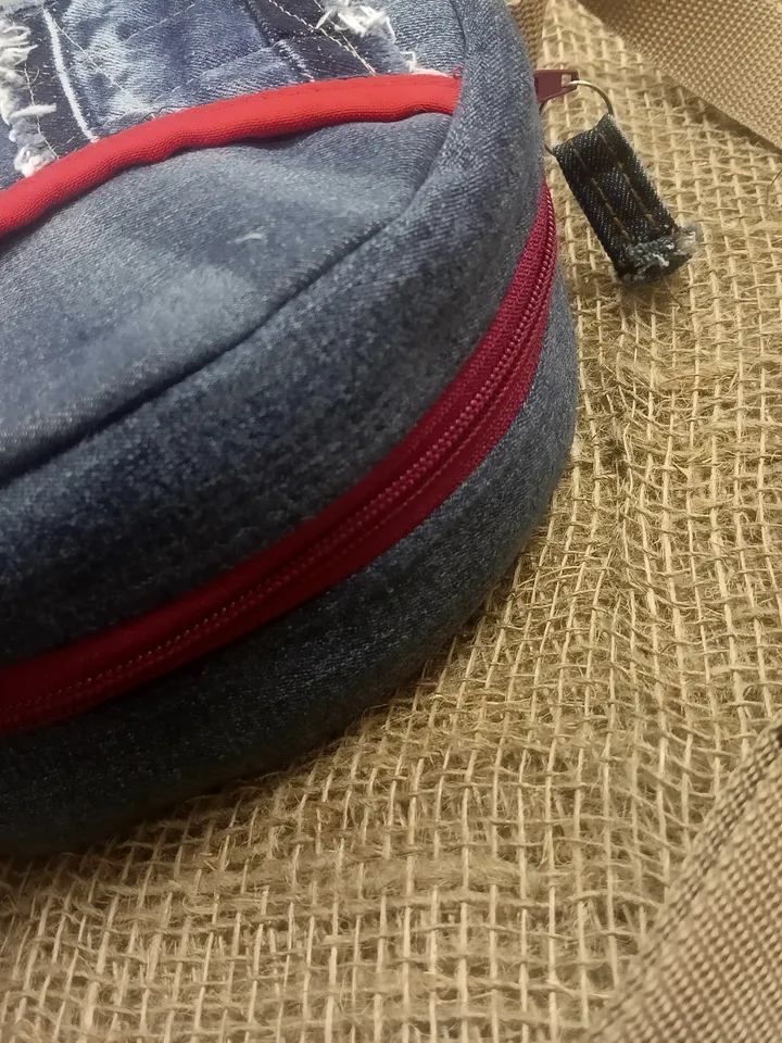 Round denim crossbody bag, for various necessary trifles, with 3 pockets and a long red strap 123 cm/48,4", cotton inside, d 19 cm/7, 5".
handbag for small things. Put your phone, wallet, glasses, keys in it and go for a walk / You will love it!