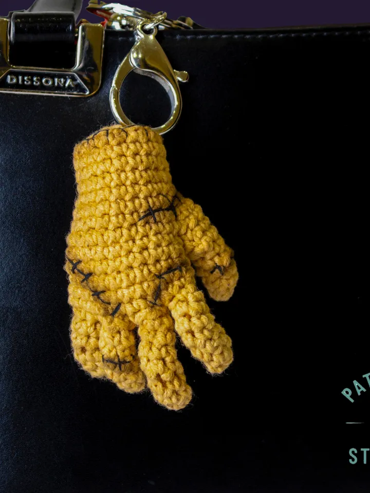 Thing crochet pattern from Wednesday -Photo tutorial of small hand from Wednesday with a heart
