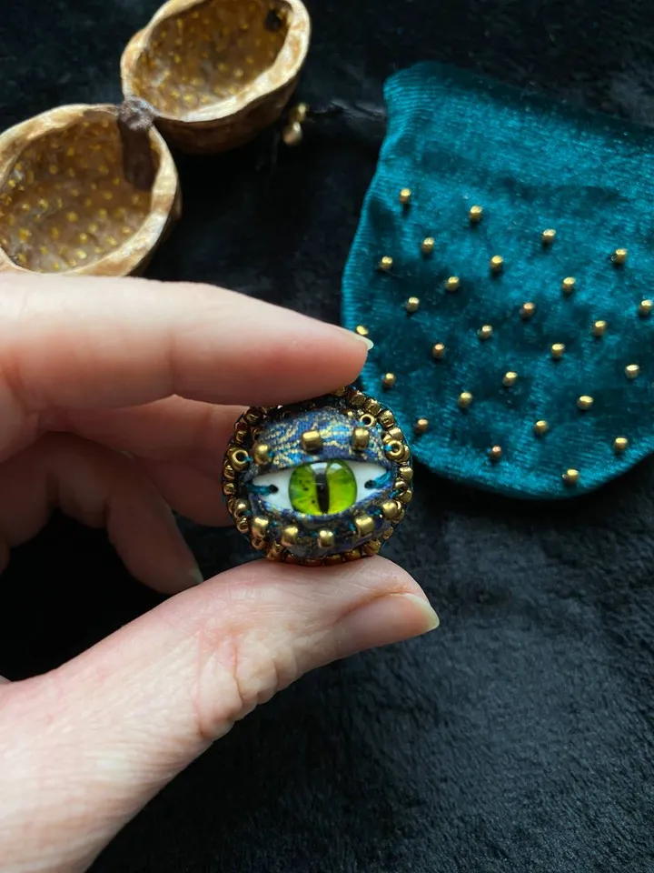 Green dragon eye brooch in walnut shell, green eye badge