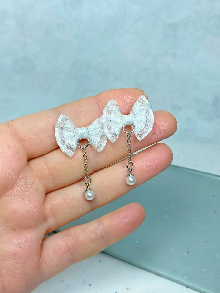 Handmade bow earrings. Author's work. Bright jewelry.
