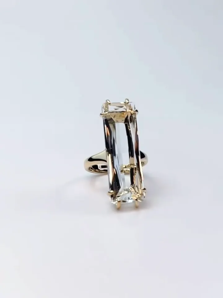 Ring gilded with a large rectangular crystal stone, one-size adjustable 16-20 size
