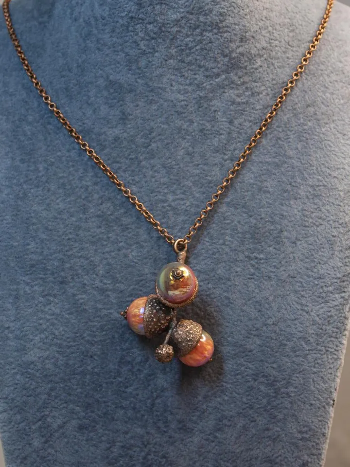 An original handmade electroformed copper pendant made from natural acorn caps in a single copy.