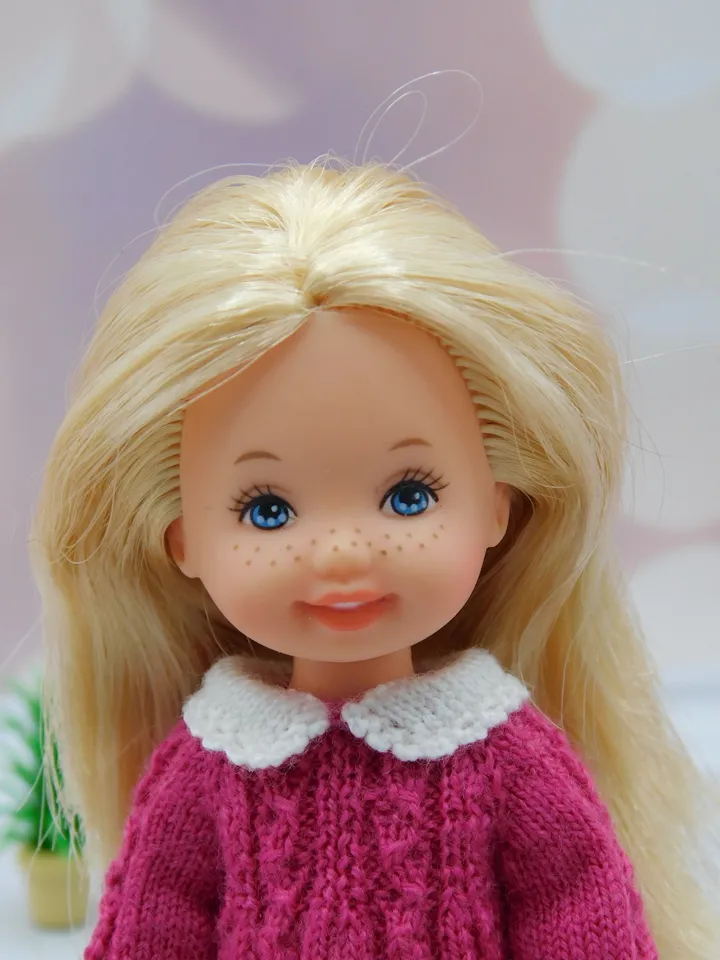 Knitted dress for Kelly doll