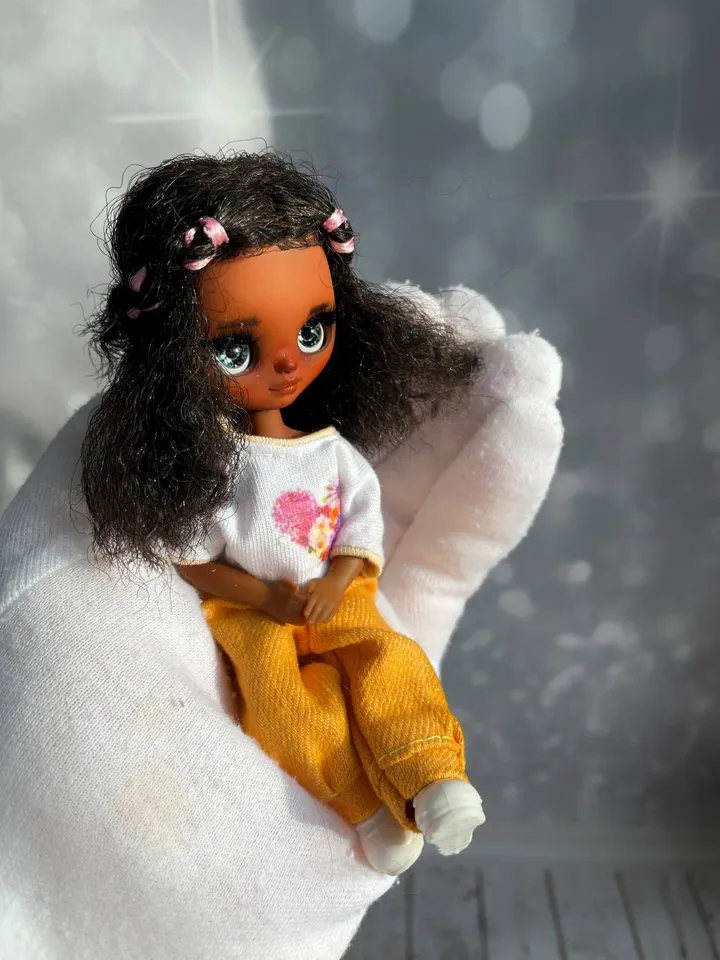 Petite Blythe with dark skin. Adorable miniature doll on an articulated body.