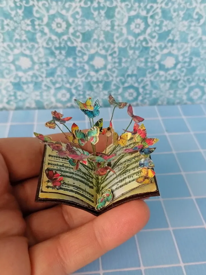 Miniature book with flying butterflies.1:12 scale.