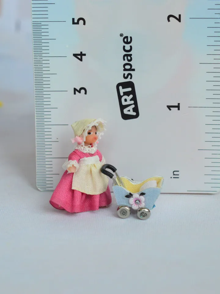 Miniature doll stroller. 1:48 scale. Dollhouse toy. Baby stroller.