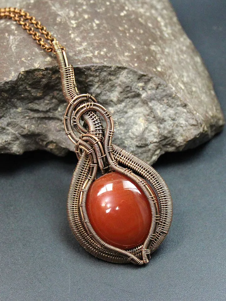 Handmade Pendant made of copper wire and natural carnelian stone