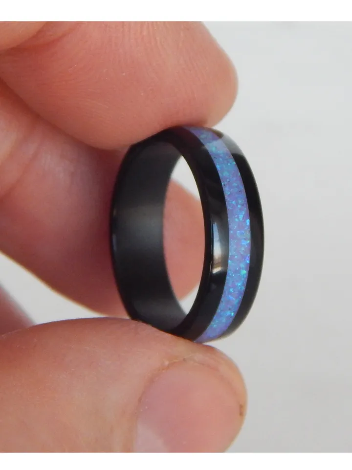 Stylish black ring. Carbon ring with synthetic opal. 7